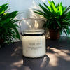 20oz KANA Candle with double wick in a glass jar with black handle lovely after dark scent and option to personalize label