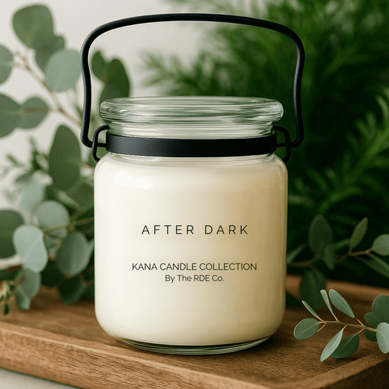 Kana Candle in After Dark, 20oz soy candle in glass jar with handle & Greenery background