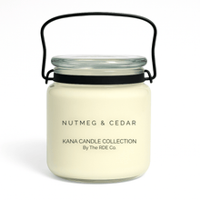  Kana Candle in Nutmeg & Cedar, 20oz soy candle in glass jar with handle & white background