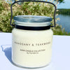 20oz Glass Jar Candle with black metal carry handle in Mahogany and teakwood frangrance