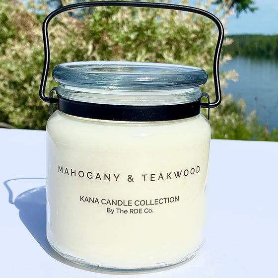 20oz Glass Jar Candle with black metal carry handle in Mahogany and teakwood frangrance