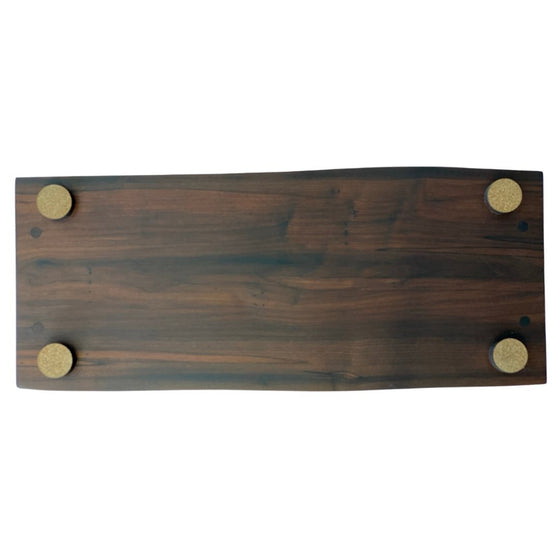 backside close up of Roasted Maple Live Edge Charcuterie Board - 24" with corked feet 