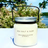 20oz Glass Jar Candle with Metal Black carry handle in sea salt and surf fragrance